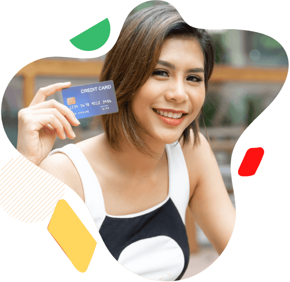 A woman holding a card and smiling