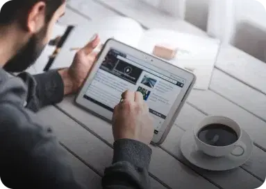 Man reading a blog on a laptop